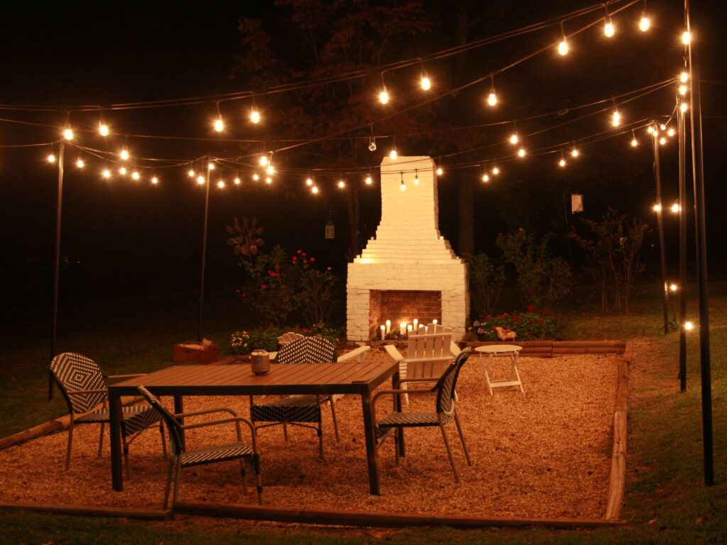 Fireplace Seating Area At Night At Gardens Wedding Venue