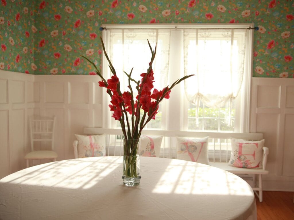 Table With Flowers In Vase