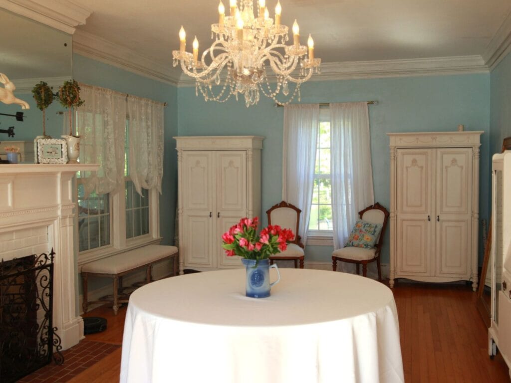 Table With Cloth And Flowers On Top Of It at Wedding Venues In Sanford NC