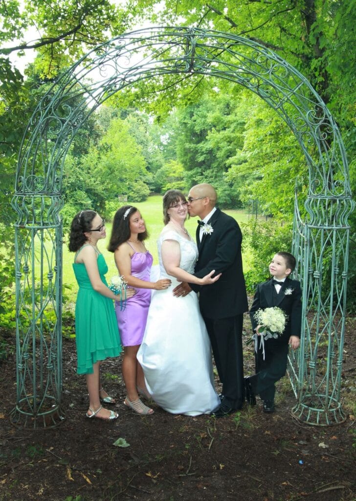 Married couple and their children on the wedding day