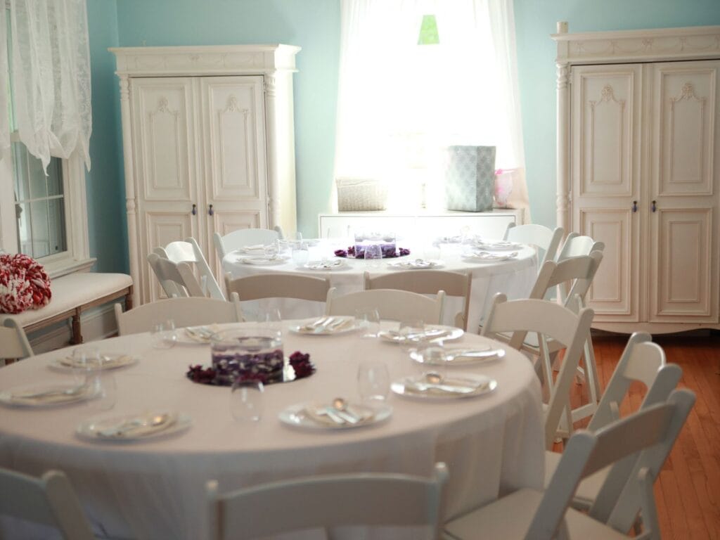 Tables Set For Dinner Inside of A Garden Wedding Venue